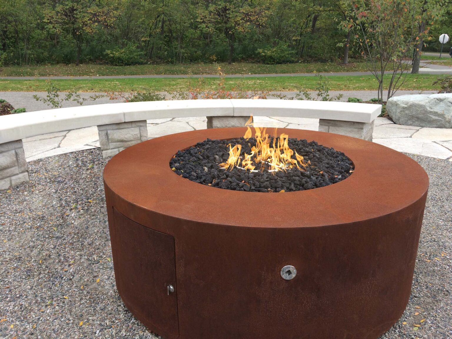 Unity Round Outdoor Fire Pit Table – Corten Steel – Liquid Propane by The Outdoor Plus