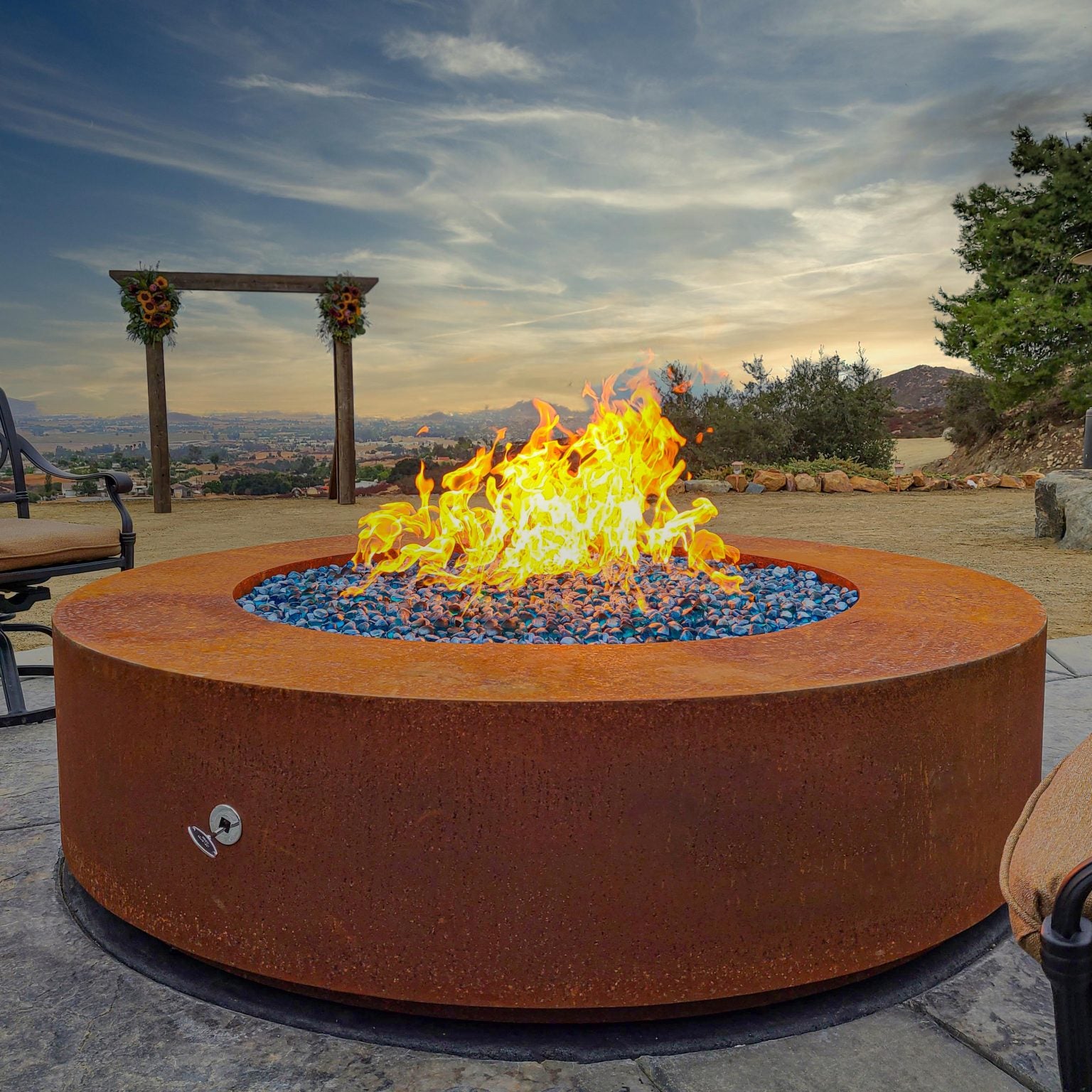 Unity Round Outdoor Fire Pit Table – Corten Steel – Liquid Propane by The Outdoor Plus